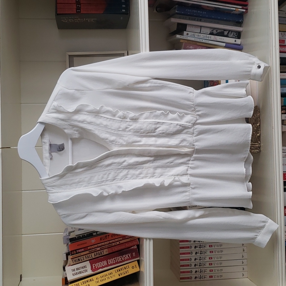 White frilly blouse